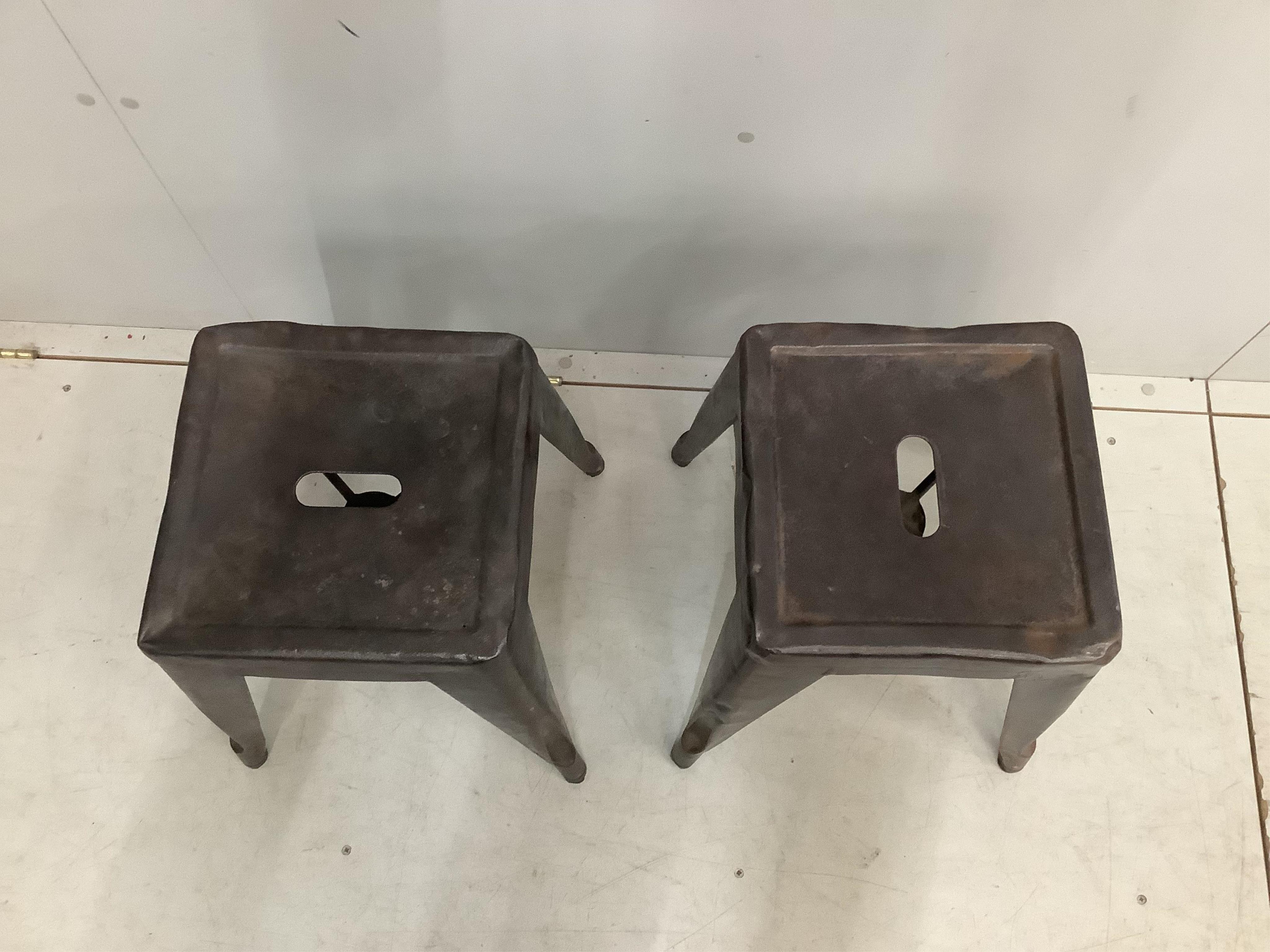A pair of Tolix vintage industrial style metal stools, width 39cm, height 44cm